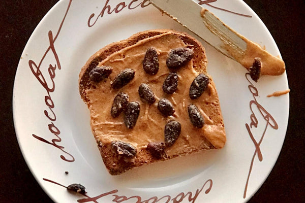 Cacao for Breakfast - Masie Jane's Almond Butter on Sprouted Grain Bread topped with Harmony Snacking Cacao